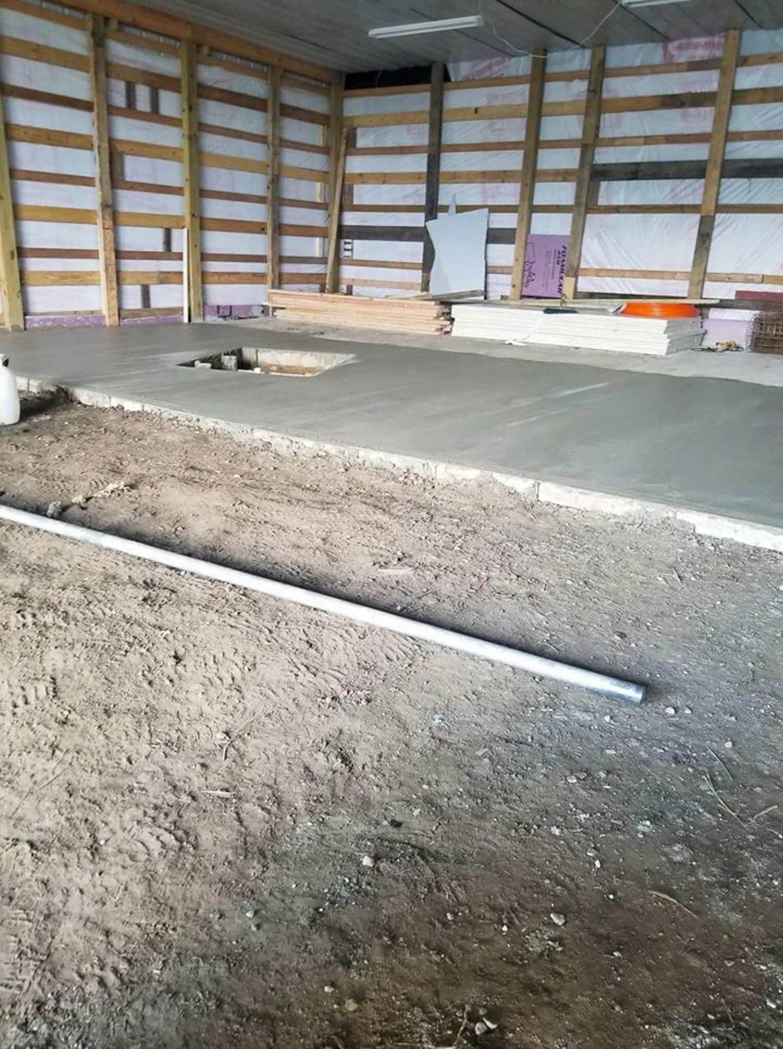 Finished concrete slab poured inside a pole barn