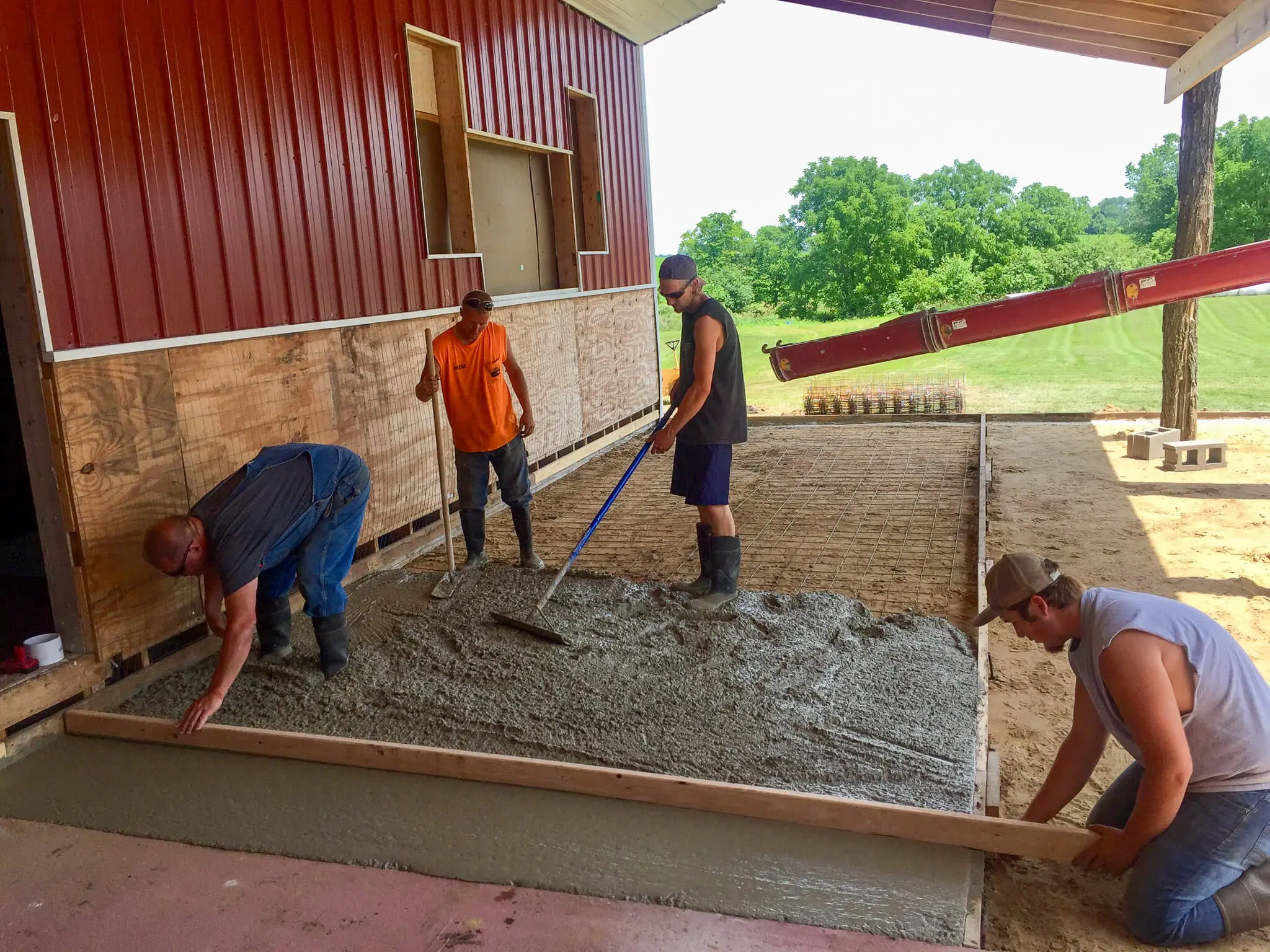 Finishing a concrete slab pour inside a new pole barn