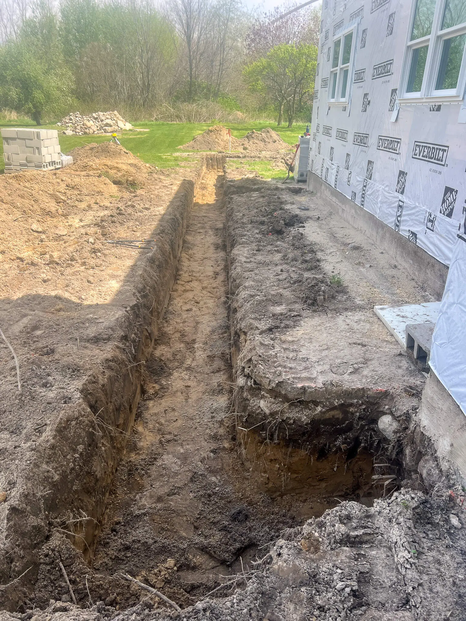 Septic tank set beside a home's foundation